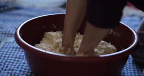 Baker hands kneading dough in flour on the ground. Видео 163616550