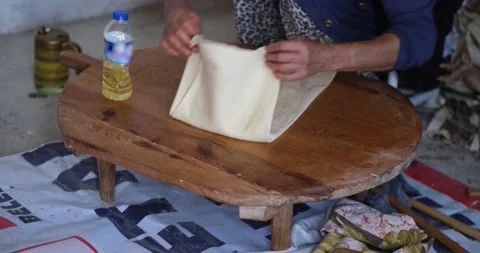 Baker hands kneading dough in flour on the table Видео 163620529
