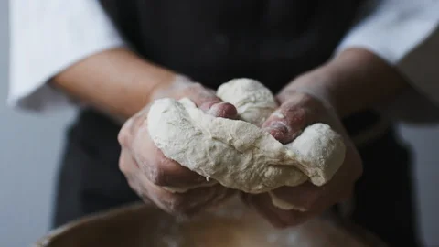 Baker hands kneading dough Stock Footage 91983184