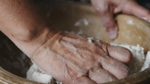 Baker hands kneading dough Stock Footage 91985259