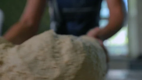 Baker Hands Kneading Dough On Table Stock Footage 89575806