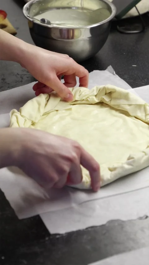 Baker hands pressing and shaping raw pastry dough for homemade pie 스톡 동영상 336848361