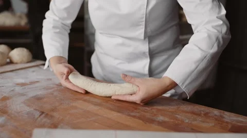 Baker hands work with dough at kitchen Stock Footage 260337388
