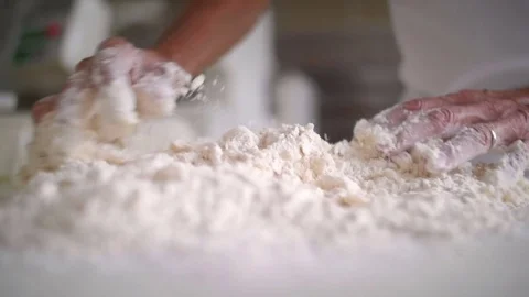 Baker hands working the flour 스톡 동영상 76559422