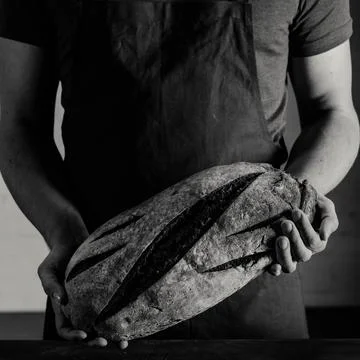 Baker holding bread Stock Photos
