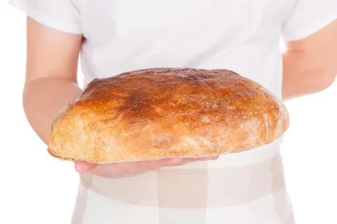 Baker holding fresh made bread. Stock Photos