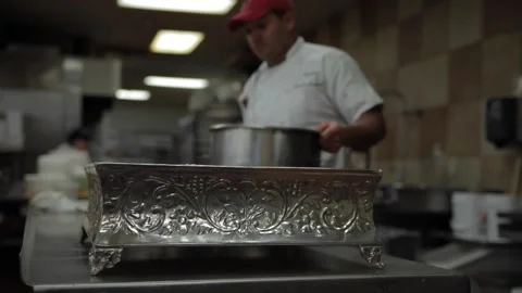 Baker in a kitchen with utensils Stock Footage 231414597