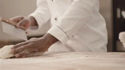 Baker Kneading and Shaping Bread Dough Stock Footage 259868734