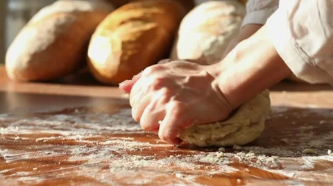 Baker kneading dough in flour on table, dolly shot HD Stock Footage 10725726