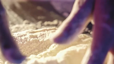 Baker kneading dough in flour on table. Close-up Stock Footage 170232932