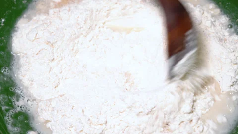 Baker kneading dough in flour on table. Stock Footage 252459938