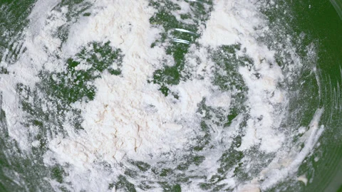 Baker kneading dough in flour on table. Stock Footage 252460282