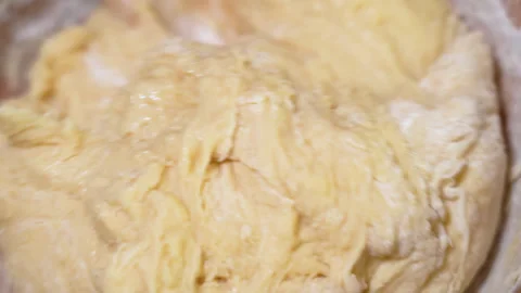 Baker kneading dough in flour on table. Stock Footage 254167822