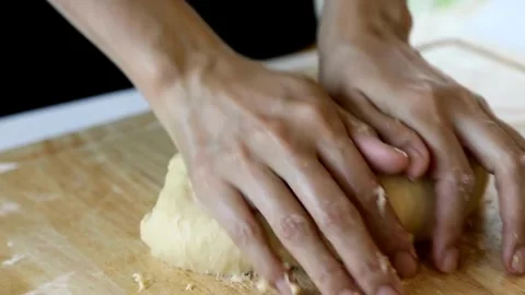 Baker kneading dough in flour on table making homemade bread close up 4k fr.. Stock Footage 272469761