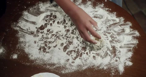 Baker Kneading Dough on Floured Table and Arranging Dough Balls on Plate Stock Footage 308054410