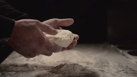 The baker is kneading the dough. Stock Footage 144344190