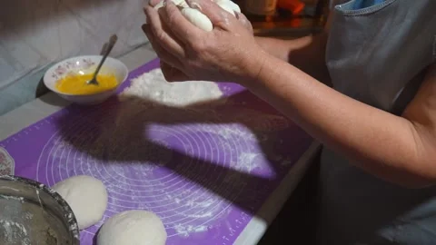 Baker kneading dough on kitchen counter Stock Footage 301401662