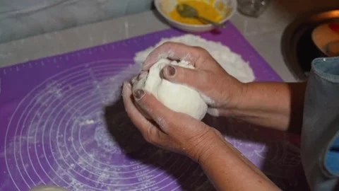 Baker kneading dough on kitchen counter 스톡 동영상 301401703