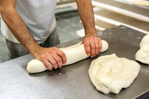 Baker kneading dough Stock Photos