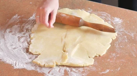 Baker kneading dough with rolling pin on table Vídeo Stock 68323694
