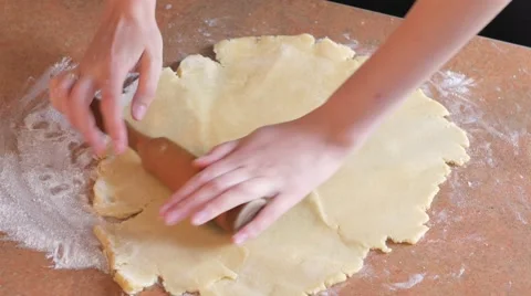 Baker kneading dough with rolling pin on table Stock Footage 68685510