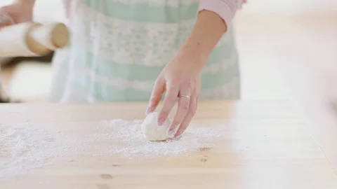 Baker kneading dough with rolling pin on wood table at home 스톡 동영상 70941457