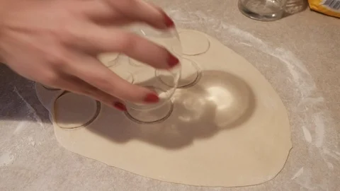 Baker kneading dough with rolling pin on table Stockbeeldmateriaal 86359482