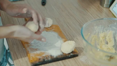Baker kneading dough with rolling pin on table Stock Footage 86517143
