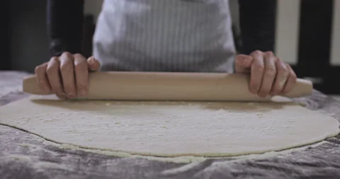 Baker kneading dough with rolling pin. Stock Footage 138695499