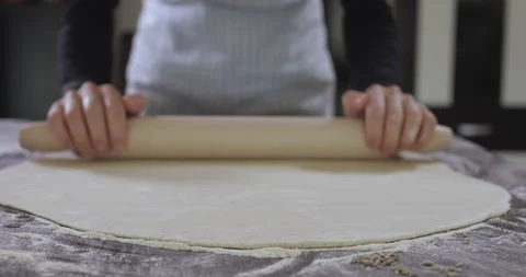 Baker kneading dough with rolling pin Stock Footage 138696247