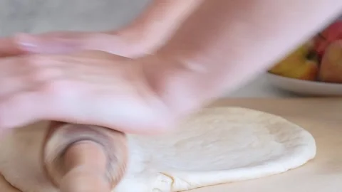 Baker kneading dough with rolling pin on table  Stock Footage 285424978
