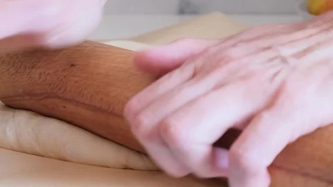 Baker kneading dough with rolling pin on table  Stock Footage 285424980