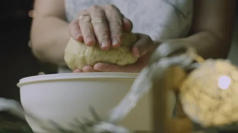 Baker kneading soft dough between both hands Stock Footage 342127983