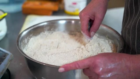 The baker kneads the dough for baking Stock Footage 297193331