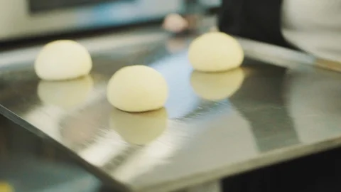 Baker kneads dough for bread baking Stock Footage 89525993