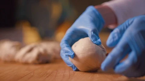 The baker kneads the dough for the cake. Stock Footage 123649747