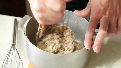 The baker kneads the dough Stock Footage 77568240