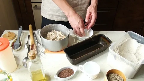 Baker kneads dough Stock Footage 77784714