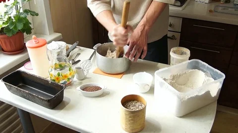 The baker kneads the dough Stock Footage 77784776