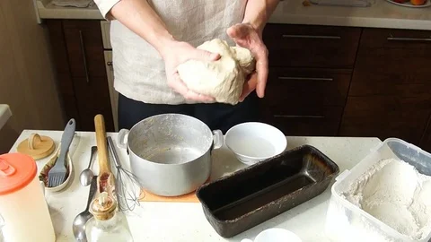Baker kneads dough Stock Footage 77953644