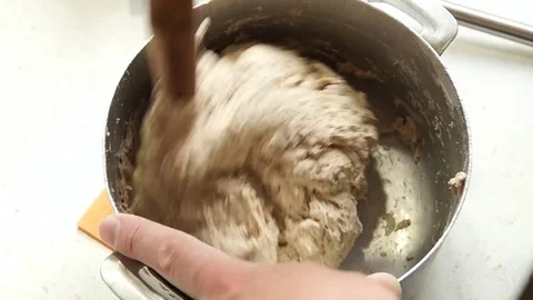 The baker kneads the dough Stock Footage 77953723