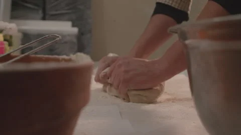 A baker kneads the dough to make bread Stock-Footage 231335106