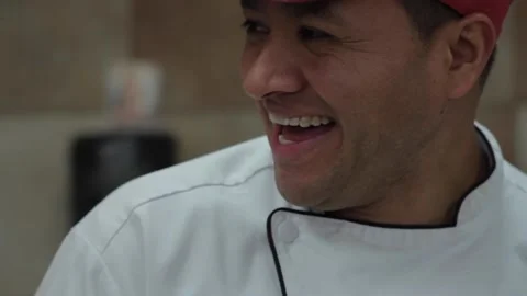 Baker laughing as he mixes cake batter Stock Footage 231414778
