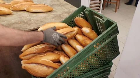 The baker is laying the breads. fresh breads Stock Footage 164291726