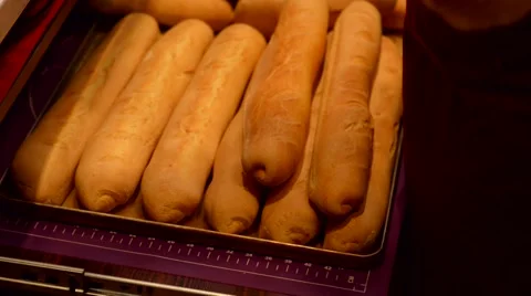 Baker lays out the bread Vídeos de archivo 59575312