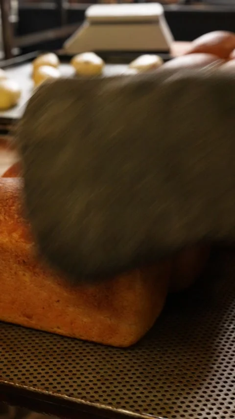 The baker lays out fresh bread Stock Footage 261250444