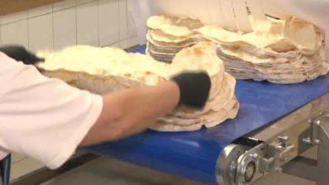 Baker lays the thin dough Stock Footage 105402635