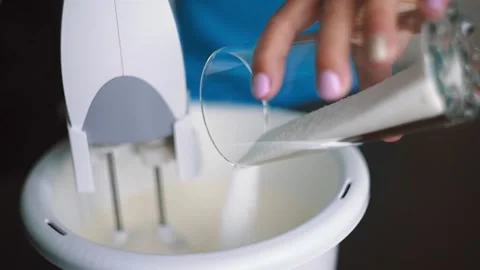 Baker makes batter and adds sugar Stock Footage 143583964
