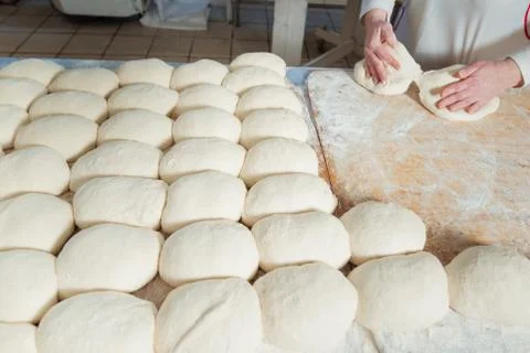 Baker makes bread dough Stock Photos