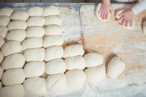 Baker makes bread dough Stock Photos